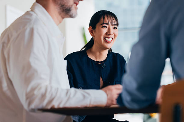 istock Friendly Business Discussion Among Team Members in a Casual Setting 2218333093