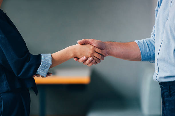 istock Business Partnership Established Through a Handshake Between Two Individuals 2218333098