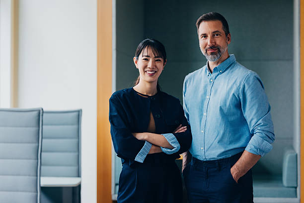 Confident Business Professionals Posing Together in a Modern Office Setting