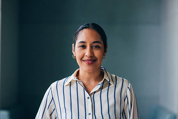 istock Confident Professional Businesswoman Smiling in Modern Office Setting 2218333126
