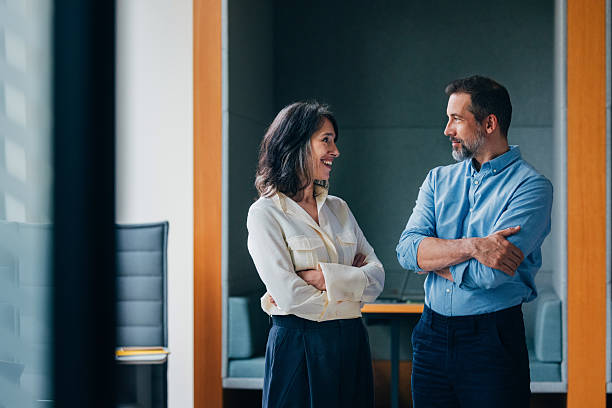 Professional Business Colleagues Having a Conversation in Modern Office Setting
