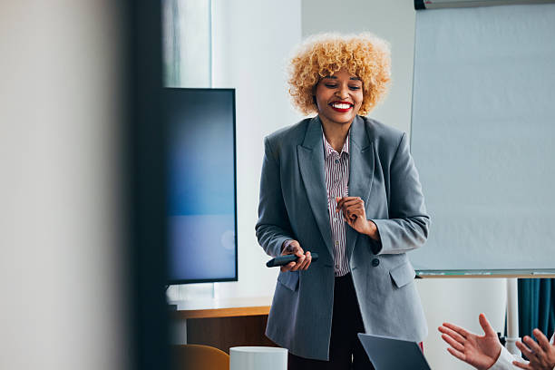 istock Confident Professional Presenting During a Business Meeting in a Modern Office 2218333153