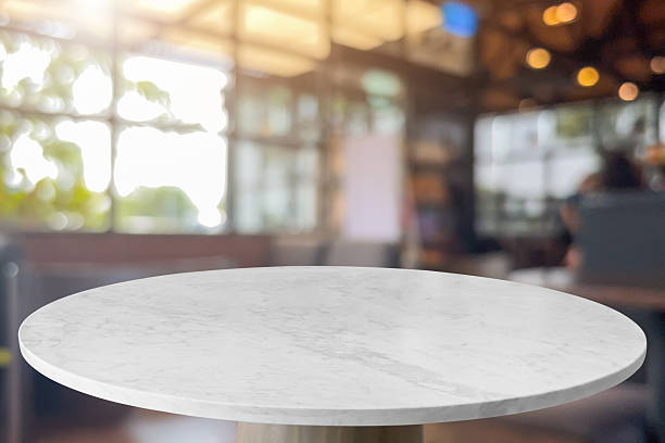 istock Round marble table top with blurred kitchen cafe restaurant interior background 2218339196