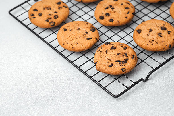 istock Freshly baked cookies cooling on a wire rack in a kitchen setting 2218340732