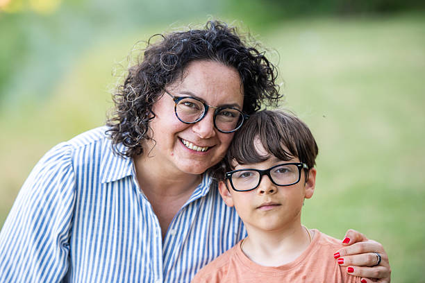 istock Smiling mature woman posing with her son 2218346986