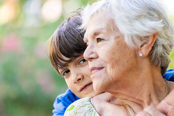 istock Smiling happy little boy hugging his grandmother 2218347979