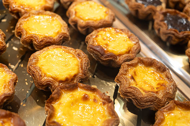 istock Portuguese egg tarts freshly baked and arranged on a display tray. 2218349104
