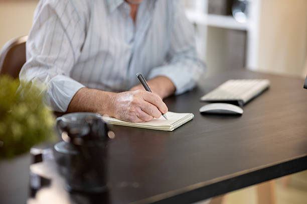 istock A businessman is sitting at his desk working. 2218350631