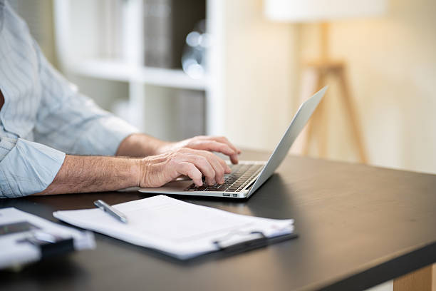 istock A businessman is sitting at his desk working. 2218350679