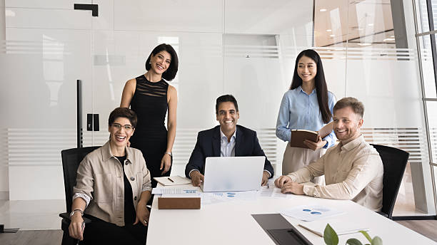 istock Five multiethnic professional corporate team posing for camera 2218354146