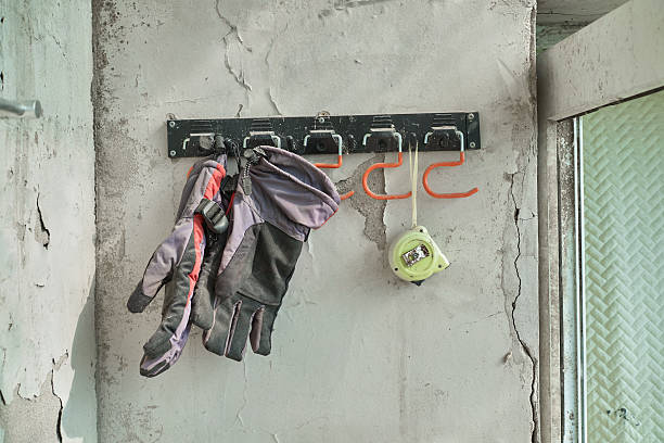 istock Gloves and a Tape Measure Hanging on a Rack 2218355898