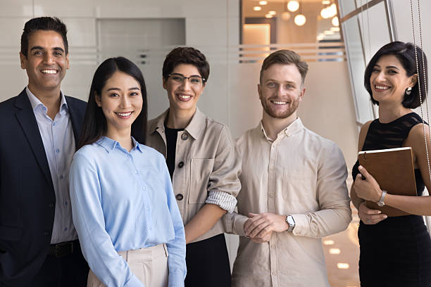 istock Confident team members posing together for camera 2218356386
