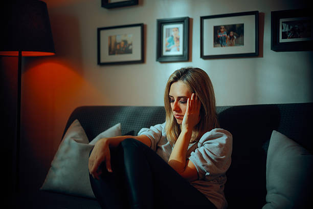 istock Sad Unhappy Woman Feeling Bad from a Migraine 2218358766