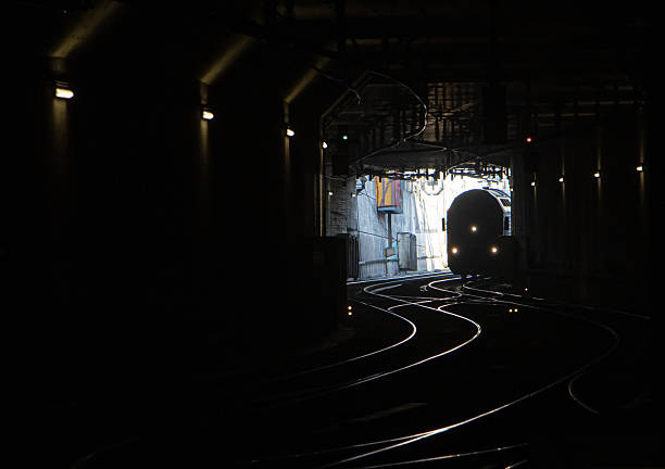São Paulo, SP, Brazil - November 08th, 2025: Tunnel descending and with signage on Line 4 (Yellow Line) of the subway.