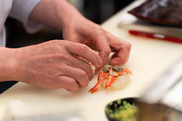 Chef Preparing Crab Nigiri Sushi with Wasabi