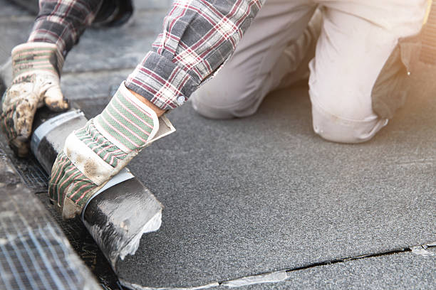 istock Roofer during waterproofing work with bitumen membranes 2218368590