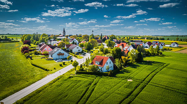 istock Idyllic Bavarian Village Surrounded by Green Fields – Aerial View 2218369401