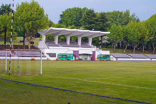 istock Soccer stadium with green field 2218369631