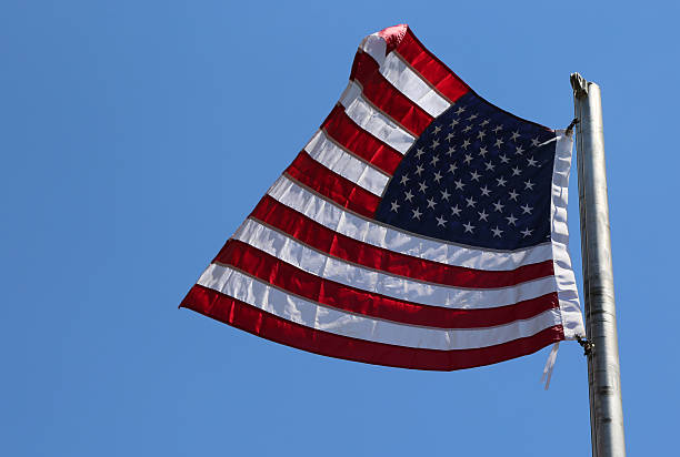 istock American Flag  flying in the air 2218369652