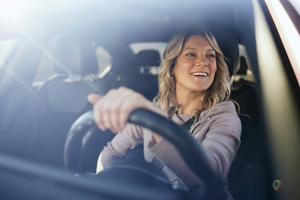istock Happy woman enjoying while driving a car. 2218371772