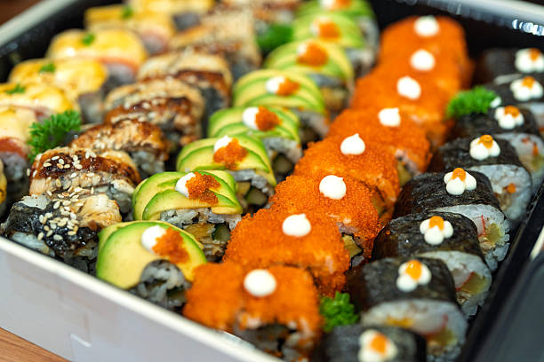 Assorted Sushi Rolls with Toppings in Takeaway Tray