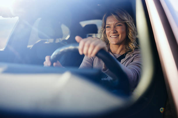 istock Happy woman enjoying while going on a trip by car. 2218372663