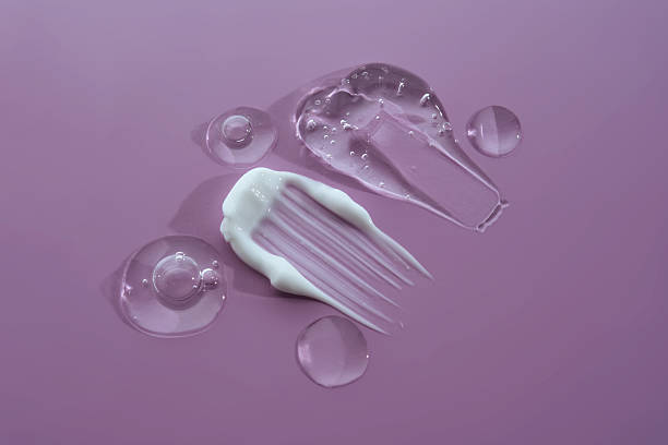 Cosmetic gel and cream on a lilac background. Texture.