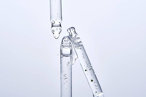 istock Three different face serum pipettes on a neutral background. 2218375371