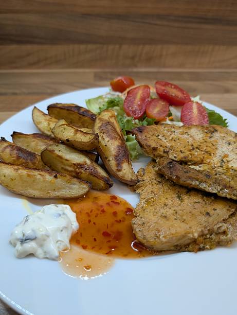 istock grilled chicken breast, potatoes and vegetable 2218375404