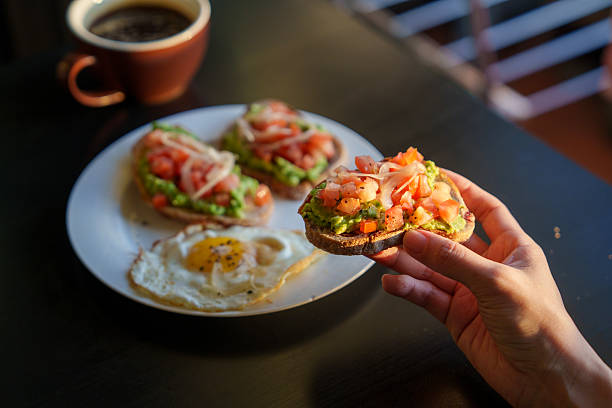 istock Avocado Toast Topped with Fresh Tomatoes and Onions 2218377309