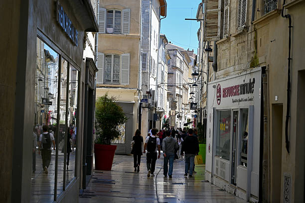 Avignon, France, may 23, 2025 : Tourists strolling along Bonneterie street in Avignon