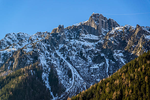 Tour du Montblanc beautiful mountain peaks and green valley. TMB trekking route scenic landscape in Alps in Chamonix valley alpine scene. Aiguilles du Chamonix, Aiguille du Dru, Petit Dru