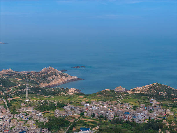 Coastal Townscape with Rocky Shoreline
