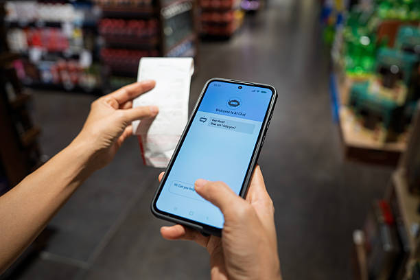istock AI chatbot interaction with smartphone and receipt in supermarket 2218388952