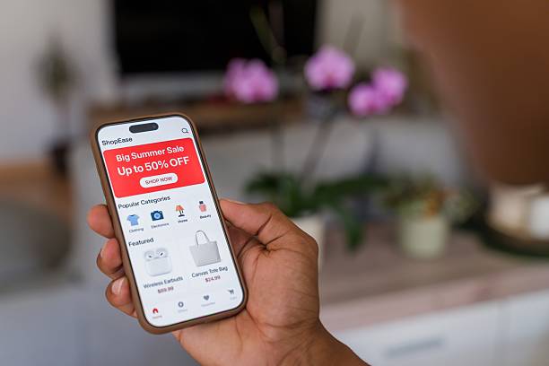 istock Customer browsing summer sale offers on mobile app 2218391593