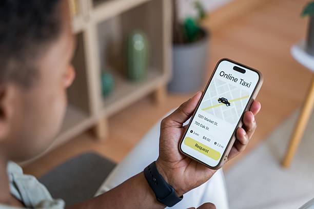 istock man requesting a taxi using a mobile app on his smartphone 2218392518