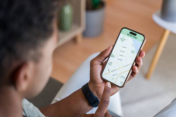 istock man consulting a map on his smartphone 2218393150