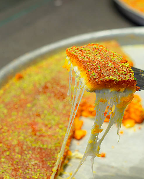 istock Nabulsi Kunafa, traditional Middle Eastern dessert made with cheese and semolina 2218394320