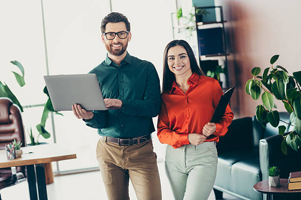 istock Confident business professionals standing in modern office, ready for collaboration and innovative teamwork 2218397047