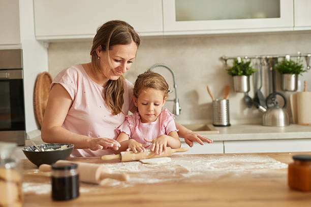 istock Mother and daughter baking together in the kitchen 2218400513