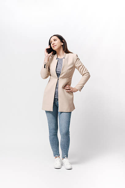 istock Woman standing and having a phone call 2218403838