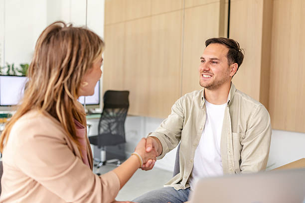istock Engaged professionals share a positive handshake in a modern office setting 2218405908