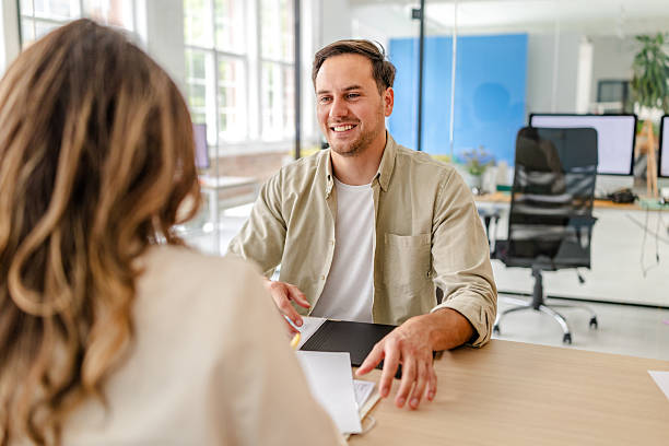 istock Engaging discussion between colleagues in a modern office environment with a focus on collaboration and productivity 2218406638