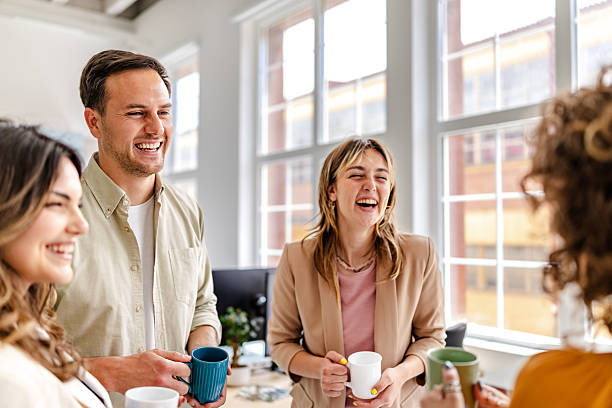 istock Enjoying a productive afternoon with colleagues in a modern office space while sharing laughs and coffee 2218406950