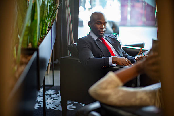 Businessman relaxing in a Hotel lobby