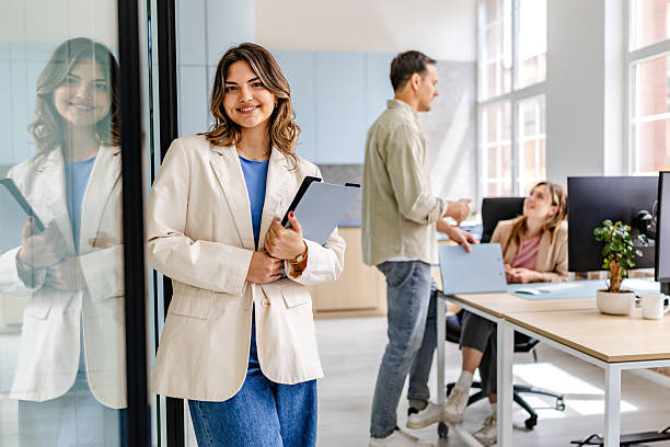 istock Modern office environment with happy coworkers collaborating and enjoying their work together 2218408390