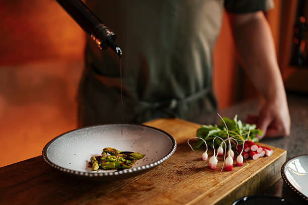 istock Male chef preparing salad in restaurant kitchen 2218409373