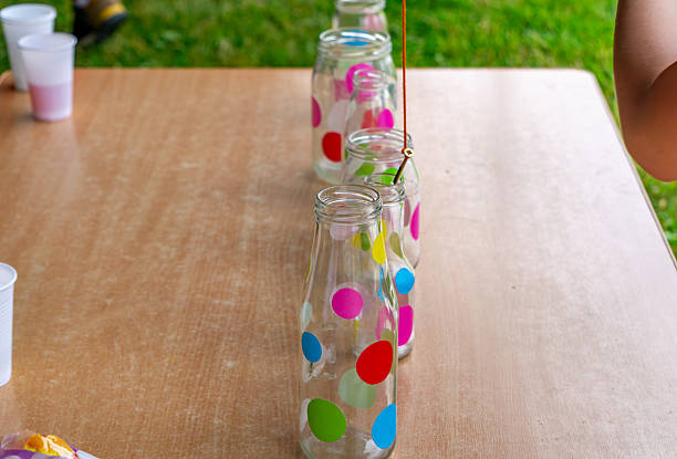 Neat transparent glass bottles on the production line of a glass factory