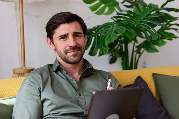 istock Confident male entrepreneur working remotely from home office 2218410333
