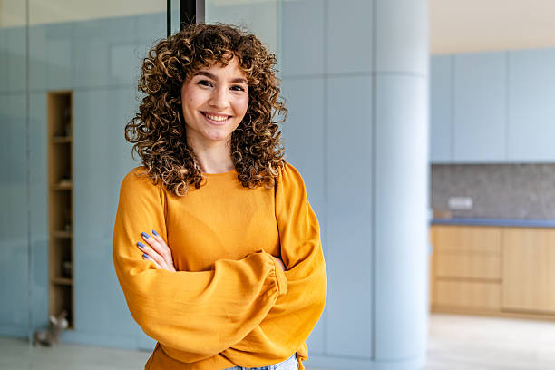 istock Smiling businesswoman in modern office setting showcases joy and professionalism during work hours 2218410471